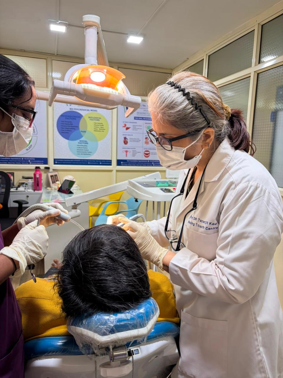 Dr. Taranjit Kaur performing oral surgery at Healing Touch Centre, Madgaon Goa